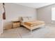 Cozy bedroom with neutral tones, a wooden bed frame, and ample natural light at 6239 Milford Sound St, Las Vegas, NV 89148