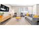 Comfortable living room featuring a grey sofa, modern furniture, and a large window at 6239 Milford Sound St, Las Vegas, NV 89148