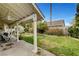 This backyard has a covered patio and mature trees that provide the perfect place for outdoor entertaining at 6304 Peppermill Dr, Las Vegas, NV 89146