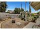 This backyard has a patio pergola with mature landscaping, perfect for entertaining guests in a private outdoor oasis at 6304 Peppermill Dr, Las Vegas, NV 89146
