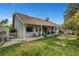 This home has a large, lush backyard with a covered patio perfect for outdoor living and entertaining at 6304 Peppermill Dr, Las Vegas, NV 89146