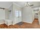 Hallway with a chandelier and wood floors leading to other parts of the home at 6304 Peppermill Dr, Las Vegas, NV 89146