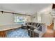 Well-lit living room with stylish decor, including a sliding barn door feature at 6304 Peppermill Dr, Las Vegas, NV 89146