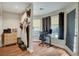Bright office featuring wood floors, storage, a workspace, and an exterior door at 6304 Peppermill Dr, Las Vegas, NV 89146