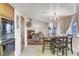 Open concept of a dining area to a living room with vaulted ceiling at 6304 Peppermill Dr, Las Vegas, NV 89146