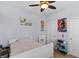 Neutral bedroom features a ceiling fan, soft bedding, closet, and curated decor for a comfortable space at 6620 Macdoogle St, Las Vegas, NV 89166