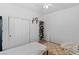 Bedroom featuring light-colored walls, a ceiling fan, and space-saving shoe rack at 6620 Macdoogle St, Las Vegas, NV 89166
