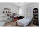 Cozy bedroom featuring a ceiling fan, ample natural light, and modern decor at 6620 Macdoogle St, Las Vegas, NV 89166
