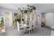 Elegant dining room boasts unique floral decor, creating a sophisticated and inviting space at 6620 Macdoogle St, Las Vegas, NV 89166