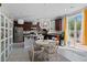 Cozy eat-in kitchen with stainless steel appliances and access to an outdoor patio with natural light at 6620 Macdoogle St, Las Vegas, NV 89166