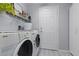 Efficient laundry room with modern appliances, storage solutions, and a clean, organized space at 6620 Macdoogle St, Las Vegas, NV 89166