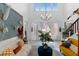 Bright living room features high ceilings, statement artwork, and stylish decor, creating a unique living space at 6620 Macdoogle St, Las Vegas, NV 89166