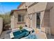 Enclosed patio with a cozy seating and dining area to enjoy the weather at 6620 Macdoogle St, Las Vegas, NV 89166