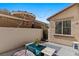 Cozy patio with colorful seating surrounding a small table and a view of string lights at 6620 Macdoogle St, Las Vegas, NV 89166