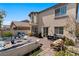 Outdoor patio features lounge seating, BBQ, dining table, and landscaped brickwork at 6620 Macdoogle St, Las Vegas, NV 89166