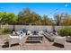 Backyard features a large conversation pit with modern outdoor furniture at 6620 Macdoogle St, Las Vegas, NV 89166