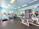 Well-lit gym features modern exercise equipment, including treadmills, elliptical machines, and weight-lifting stations at 6650 W Warm Springs Rd # 2173, Las Vegas, NV 89118
