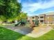 Community playground with slides, climbing structures, and a wood chip ground cover, surrounded by green lawns at 6650 W Warm Springs Rd # 2173, Las Vegas, NV 89118