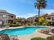 Beautiful community pool surrounded by lush landscaping, perfect for relaxing and enjoying the sunshine at 6650 W Warm Springs Rd # 2173, Las Vegas, NV 89118