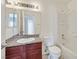Well-lit bathroom featuring a vanity with granite countertop, bathtub and toilet at 6800 E Lake Mead Blvd # 2050, Las Vegas, NV 89156