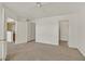 Bright bedroom featuring neutral carpet, three doors, and overhead fan at 6800 E Lake Mead Blvd # 2050, Las Vegas, NV 89156