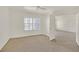 Carpeted bedroom with natural light from the window and view into the doorway at 6800 E Lake Mead Blvd # 2050, Las Vegas, NV 89156