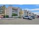 Inviting exterior of multi-Gathering apartment building with private balconies and ample parking at 6800 E Lake Mead Blvd # 2050, Las Vegas, NV 89156