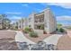 A walkway leads to residential buildings with balconies and well maintained landscaping at 6800 E Lake Mead Blvd # 2050, Las Vegas, NV 89156