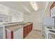 Efficient kitchen with granite countertops, white appliances, and convenient layout at 6800 E Lake Mead Blvd # 2050, Las Vegas, NV 89156