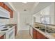 Bright kitchen featuring tile floors, granite countertops, and modern appliances, with an open view into an adjoining room at 6800 E Lake Mead Blvd # 2050, Las Vegas, NV 89156