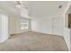 Spacious living room with neutral carpet, ceiling fan, and lots of natural light at 6800 E Lake Mead Blvd # 2050, Las Vegas, NV 89156