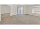 Bright, open living room with sliding glass door to balcony, great for entertaining at 6800 E Lake Mead Blvd # 2050, Las Vegas, NV 89156