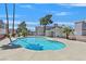 Community pool surrounded by lush trees at 6800 E Lake Mead Blvd # 2050, Las Vegas, NV 89156