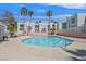Community pool with palm trees at 6800 E Lake Mead Blvd # 2050, Las Vegas, NV 89156