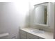 Bright bathroom featuring a single sink vanity with a medicine cabinet at 7170 Mountain Moss Dr, Las Vegas, NV 89147
