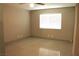 Bedroom featuring tile flooring, natural light from a large window and neutral color at 7170 Mountain Moss Dr, Las Vegas, NV 89147