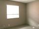 Bedroom with tile flooring and a large window providing natural light at 7170 Mountain Moss Dr, Las Vegas, NV 89147