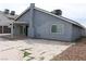 Exterior view of the home showcasing the covered patio and backyard at 7170 Mountain Moss Dr, Las Vegas, NV 89147