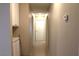 Hallway featuring tile flooring, neutral color palette, and access to other rooms at 7170 Mountain Moss Dr, Las Vegas, NV 89147