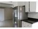 Modern kitchen featuring stainless steel appliances, sleek countertops, and ample cabinet space at 7170 Mountain Moss Dr, Las Vegas, NV 89147