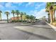 Gated entry to the Nevada Trails community, framed by mature trees, lush landscaping, and manicured lawns at 7181 Barton Creek Ct, Las Vegas, NV 89113