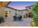 Private courtyard with a water feature and stone accents offers a serene outdoor living space at 7181 Barton Creek Ct, Las Vegas, NV 89113