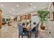 Dining area adjacent to kitchen with natural light and view of living area at 7181 Barton Creek Ct, Las Vegas, NV 89113