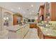 Open kitchen with granite countertops, stainless steel appliances and large island at 7181 Barton Creek Ct, Las Vegas, NV 89113