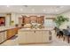 Spacious kitchen with island, granite countertops, and custom cabinets at 7181 Barton Creek Ct, Las Vegas, NV 89113