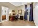 Office with hard wood floors, large desk, and access to a bathroom at 7181 Barton Creek Ct, Las Vegas, NV 89113