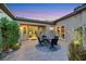 Covered patio with stylish seating area provides an excellent space for outdoor relaxation and entertaining at 7181 Barton Creek Ct, Las Vegas, NV 89113