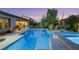 Serene backyard pool with lush landscaping provides a private retreat for relaxation and outdoor enjoyment at 7181 Barton Creek Ct, Las Vegas, NV 89113