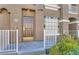 Inviting front entrance with a decorative tiled accent wall and a well-maintained garden at 7250 Diamond Canyon Ln # 204, Las Vegas, NV 89149