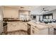 Bright kitchen with stainless steel appliances, white cabinets, and a marble countertop island with seating at 7250 Diamond Canyon Ln # 204, Las Vegas, NV 89149